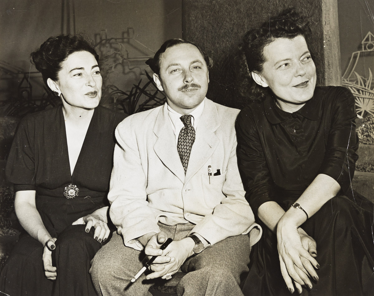 (TENNESSEE WILLIAMS) Portrait of the playwright at a farewell party with his two producers, Irene Selznick and Margo Jones.